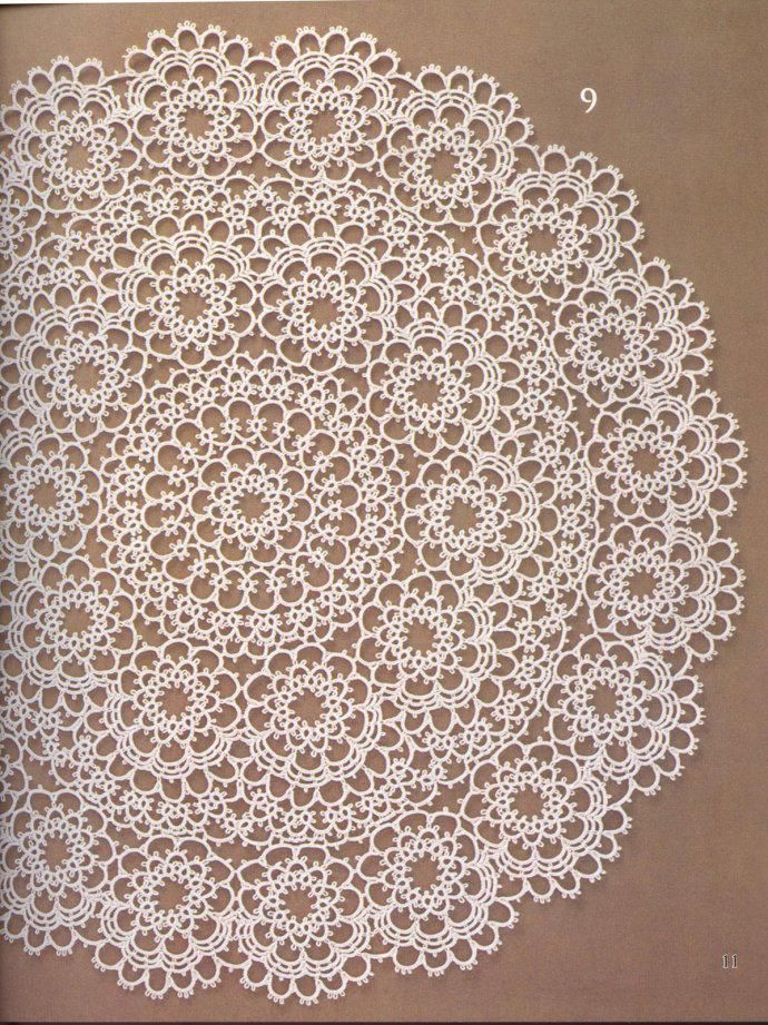 a white doily sitting on top of a brown table