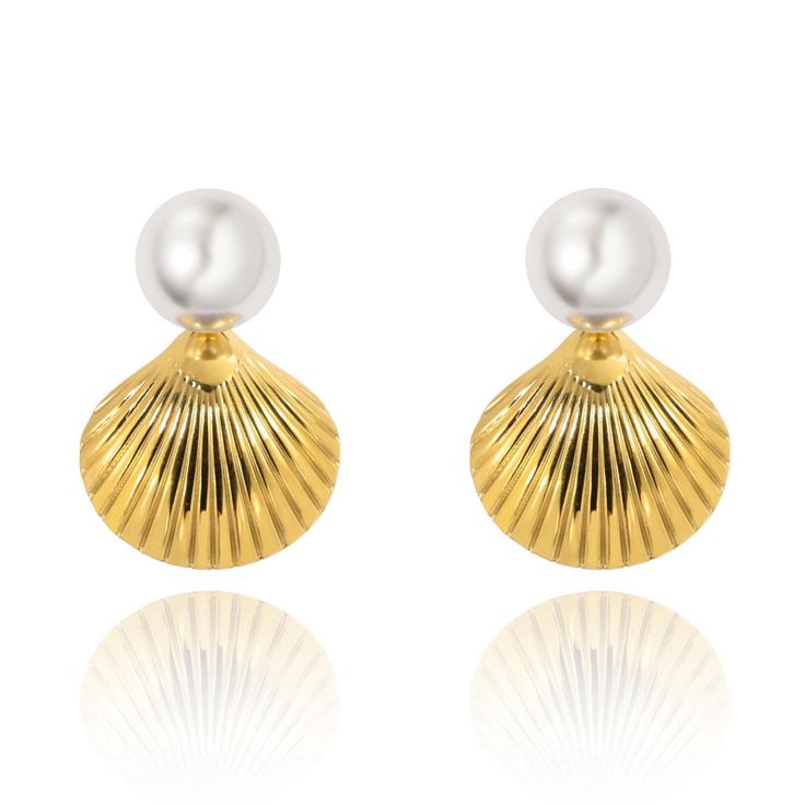 Complete your elegant look with our Sylvie Pearl Earrings. These stunning earrings feature a delicate pearl stud and a beautiful gold shell design, adding a touch of sophistication to any outfit. Perfect for any occasion, they make a great addition to your jewelry collection. 18k Gold Plated over Stainless Steel 1.1" Hypoallergenic Water & Tarnish Resistant Gold Shell With Pearl Drop, Elegant Shell With Pearl Charm, Elegant White Shell Pearl Earrings, Elegant Shell-shaped Earrings With Pearl Charm, Elegant White Shell With Pearl Pendant, Elegant Gold Plated Shell Jewelry, Elegant Shell Pearl Earrings For Gift, Elegant Shell Earrings For Gifts, Elegant Pearl Shell With Pearl Drop