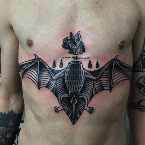 a man with a bat tattoo on his chest