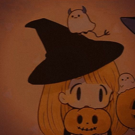 a woman with blonde hair wearing a black witches hat and two pumpkins in front of her