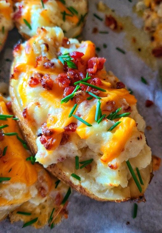 baked potatoes with cheese and bacon on top