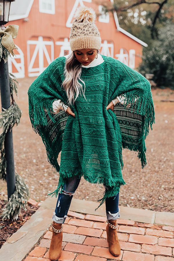 Layer up in style with our beautiful green 'Love And Joy' poncho featuring warm intricately knit material, a rounded neckline, ultra frayed trim detailing, open sides, and a draped silhouette that cascades into an uneven lower-thigh length hemline! Measurements One Size : Bust 80", Hip 80", Length 27", Sleeve Length 15", Waist 80". Knit Poncho, Knitted Poncho, Knitting Materials, In Style, Winter Hats, Sleeve Length, Trim, Luxury Fashion, Knitting