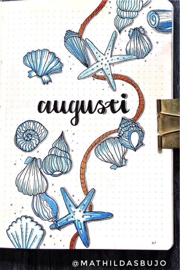 an open notebook with sea shells and starfish on the cover that says augusti