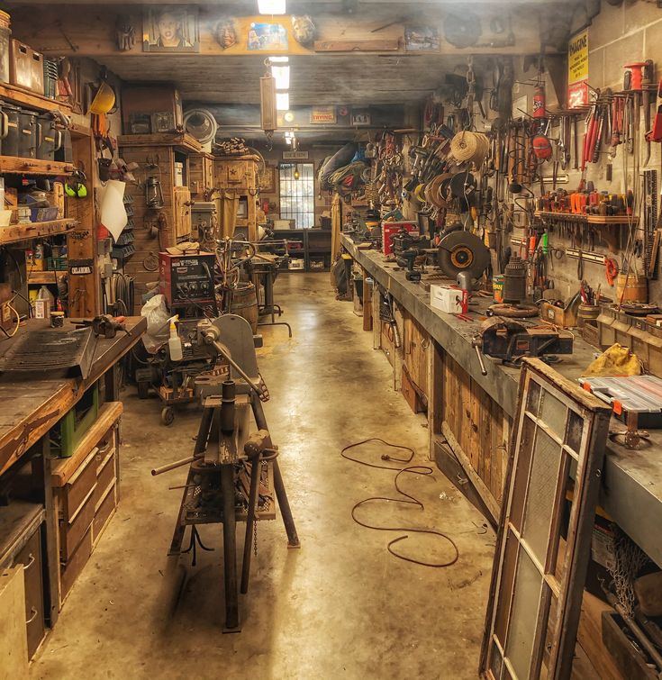 the shop is full of tools and workbenches