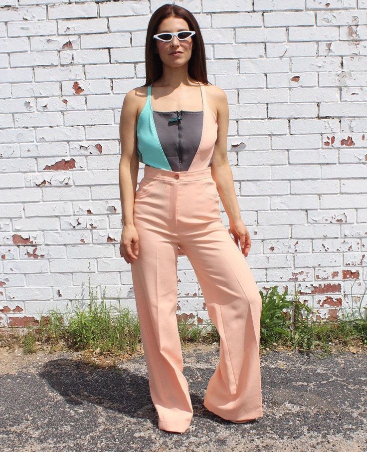 80's Vtg Peach Polyester Pants: These pants will easily add a funky vibe to any outfit. Tag Information:  N/A Size-Unmarked (Women) Will fit sizes XS,S,2,4 to be sure these pants will fit you please look at the measurements below: Measurements 26" Around waist 32" Around Hips 43" Waist to hem  31.25" Pant inseam Condition- Very Good vintage condition. These pants look like they have been really well taken care of and the color looks great. 70s Inspired High Waist Bottoms For Spring, Pink High-rise Pants For Summer, High Rise Pink Summer Pants, Pink High Rise Summer Pants, High Rise Pink Pants For Summer, 70s Inspired High Waist Spring Pants, High Waist 70s Inspired Pants For Spring, 70s Inspired Fitted High Waist Bottoms, 90s Style Pink Wide Leg Pants