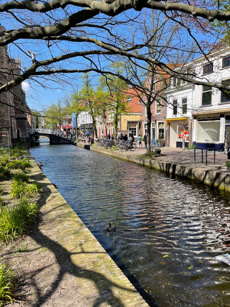 a river running through a city next to tall buildings