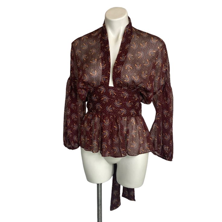 A Fun Burgundy Boho Print Sheer Long Sleeve Tie Waist Blouse From Zara. * Condition: Pre-Owned Consignment W/ Tags * Size: Xs * Pit To Pit: 22" * Length: 23.5" (In Back) Fitted Brown Tops For Daywear, Zara Vintage Fitted Tops, Fitted Zara Tops For Daywear, Bohemian Fitted Zara Blouse, Tie Waist Top, Sheer Long Sleeve, Boho Print, Red Purple, Zara Tops