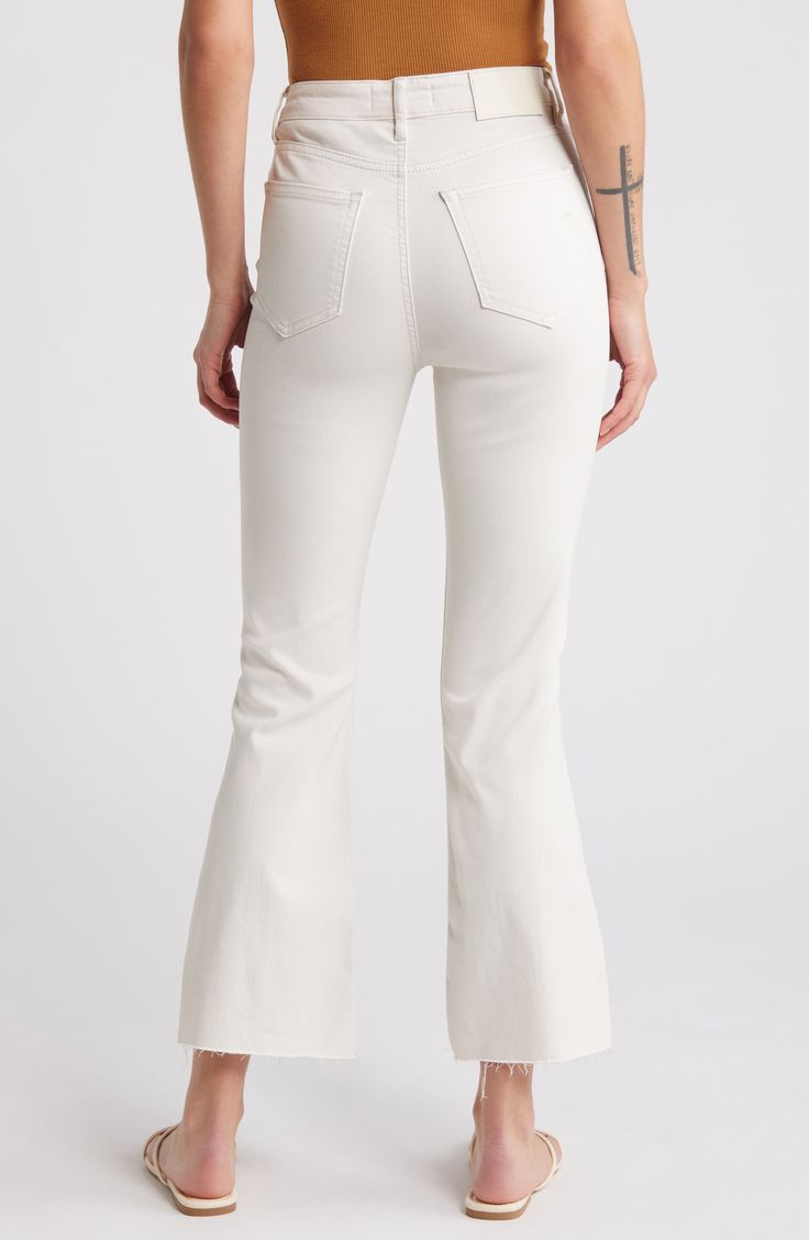 Laid-back and perfect for casual days, these cropped high-waist wide-leg jeans feature raw step hems and shredded knees for edgier styling. 27" inseam; 11 1/2" front rise Zip fly with button closure Five-pocket style 57% cotton, 35% Tencel® lyocell, 6% polyester, 2% spandex Tencel lyocell is a more-sustainably produced fiber made with closed-loop processing Machine wash, tumble dry Imported Chic Flared Jeans With Frayed Hem, Summer Flare Pants With Frayed Hem, Trendy Wide Leg Flare Jeans With Frayed Hem, Fitted Cropped Bottoms With Frayed Hem, Chic Pants With Frayed Hem For Fall, Chic Flare Jeans With Frayed Hem For Fall, White Relaxed Fit Flare Jeans With Frayed Hem, Chic High Rise Flare Jeans With Frayed Hem, Fitted Wide Leg Cropped Jeans With Frayed Hem