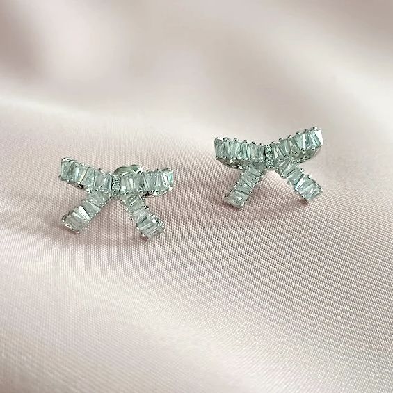 Elegant Wedding Jewelry With Decorative Bow, Elegant Crystal Cluster Earrings, Chic Bow Earrings For Anniversary, Feminine Bow Earrings For Formal Occasions, Feminine Formal Bow Earrings, Formal Feminine Bow Earrings, Party Jewelry With Diamond Bow, Chic Silver Earrings With Decorative Bow, Glamorous Crystal Diamond Earrings As Gift