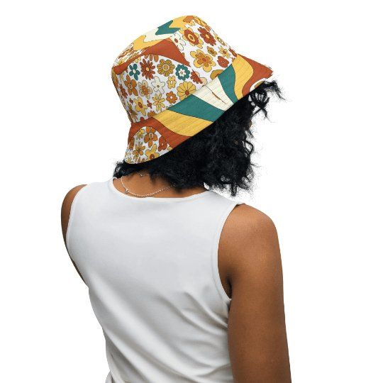 Be the life of the party with this 70s Retro Sunshine Mid Century Modern Hippie, Orange, Yellow Reversible Bucket Hat! Reminiscent of the carefree summer days and bohemian style of the 70's, this go-to hat is custom made and tailored to fit This stylish two-in-one design combines mid century modern vintage florals in a classic burnt orange, green and yellow hues, perfect for any boho wardrobe. Crafted from moisture-wicking and breathable fabric, it has a linen feel that's sure to keep you cool d Trendy Hats For Spring Music Festival, Bohemian Adjustable Sun Hat For Day Out, Spring Music Festival Sun Hat With Curved Brim, Adjustable Hats For Spring Music Festival, Trendy White Sun Hat For Festival, Trendy Adjustable Sun Hat For Festivals, Trendy Adjustable Sun Hat For Festival, Hippie Spring Hats Adjustable Fit, Hippie Spring Hats With Adjustable Fit