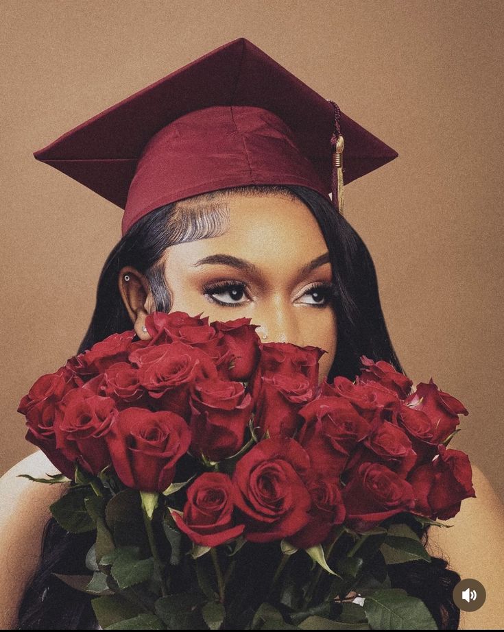 a woman wearing a graduation cap and gown with roses in front of her face, holding a bouquet of red roses