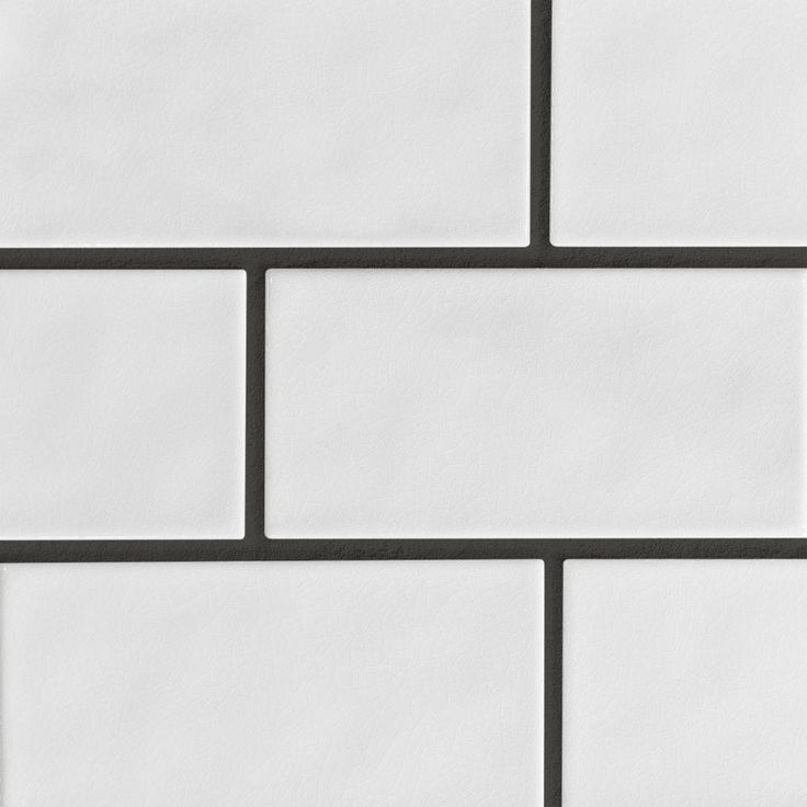 a white brick wall with black lines on it