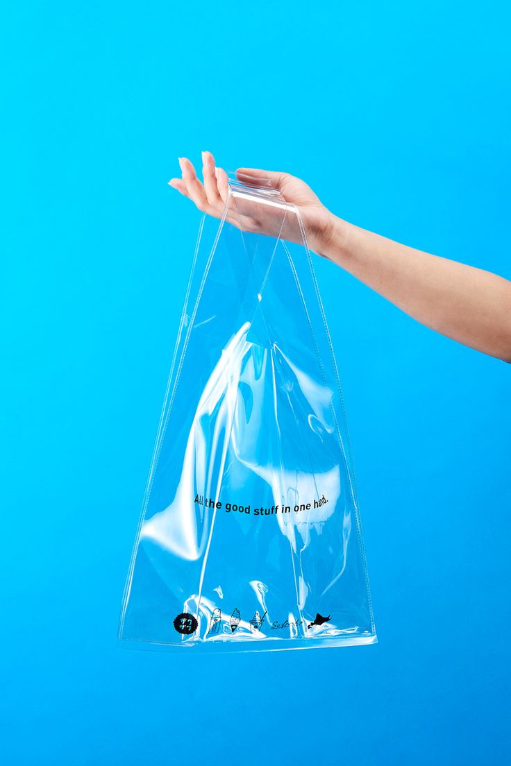 a person's hand holding a clear plastic bag