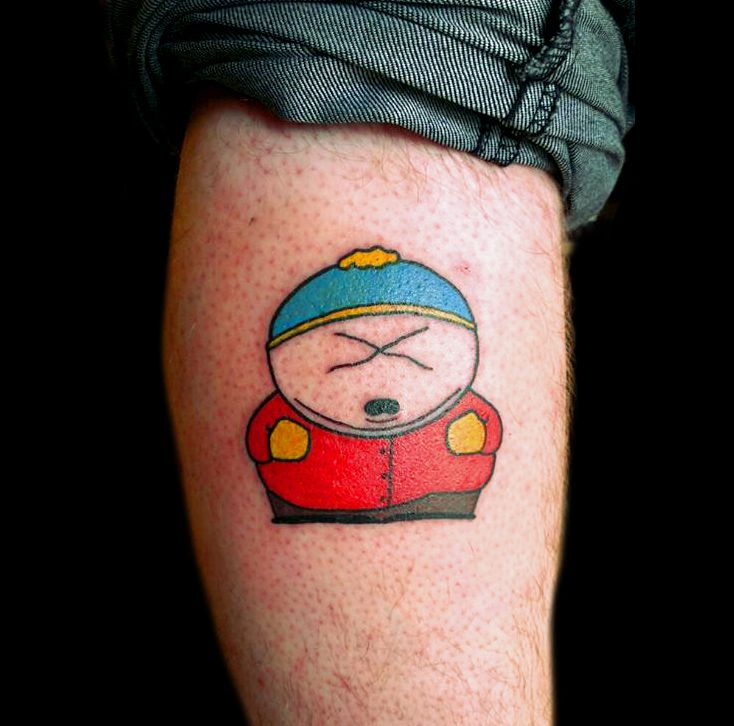 a person with a cartoon character tattoo on their leg