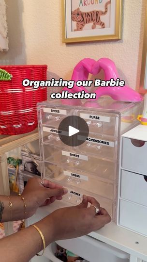 a woman is organizing her baby's collection with clear drawers and plastic bins