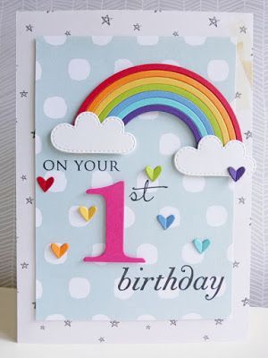 a birthday card with the number one on it and rainbows in the sky above