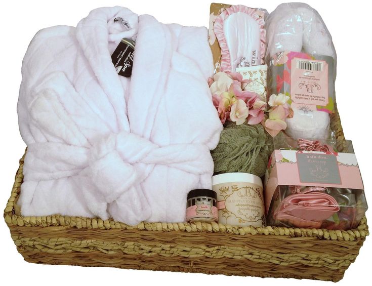 a basket filled with white towels and other items