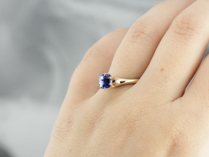 Warm gold complements perfectly with rich, deep blue in this lovely solitaire ring! The brightly polished sides have a nice heft to them, giving the ring a luxurious weight on the finger. The balance is perfect, both in the proportion of stone to gold and in the flowing slope of the mounting itself. We've set this classic mounting with one of our best stones, a benchmark quality Ceylon Sapphire in the perfect shade of deep, cornflower blue. This gemstone is of the highest possible quality, suita Royal Blue Round Sapphire Ring, Classic Sapphire Rings In Royal Blue, Classic Royal Blue Sapphire Ring, Elegant Square Cut Sapphire Ring With Prong Setting, Luxury Classic Royal Blue Ring, Yellow Gold Sapphire Ring, Sapphire Solitaire Ring, Antique Engagement Ring, Ceylon Sapphire