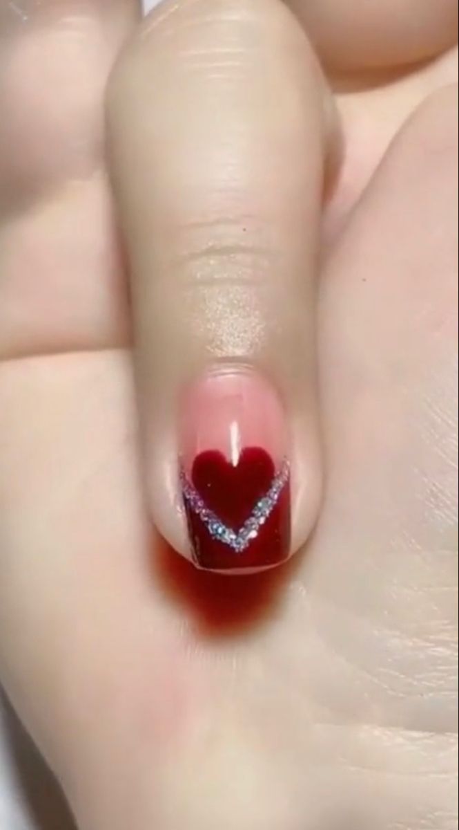 A red french tip with a red heart above and sparkles inbetween. Red Glitter French Tip, Glitter French Tip, Red French Tip, Glitter Tip Nails, Red Nails Glitter, Fall Acrylic, Glitter French Tips, Heart Nail Designs, Red French