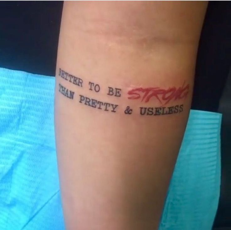 a person with a tattoo on their arm that says, better to be strong than pretty and useful