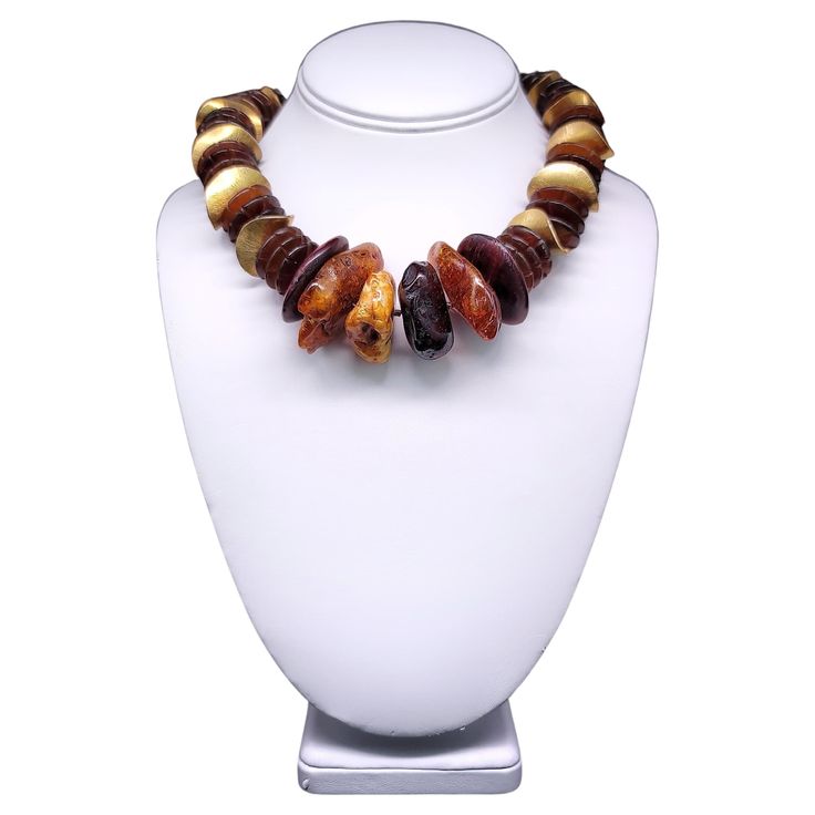 This one-of-a-kind necklace is a unique blend of different elements that come together in perfect harmony. The warm, honey-colored Baltic Amber beads and intricately polished and carved wooden beads from the Philippines make for an unusual yet stunning combination. The large curved vermeil beads provide a beautiful accent, giving the necklace a touch of elegance and sophistication. The piece is finished off with a vermeil box clasp, ensuring a secure and comfortable fit. Hand-knotted using silk, Different Elements, Wood Necklace, Honey Colour, Box Clasp, Amber Beads, Perfect Harmony, Come Together, Baltic Amber, The Philippines