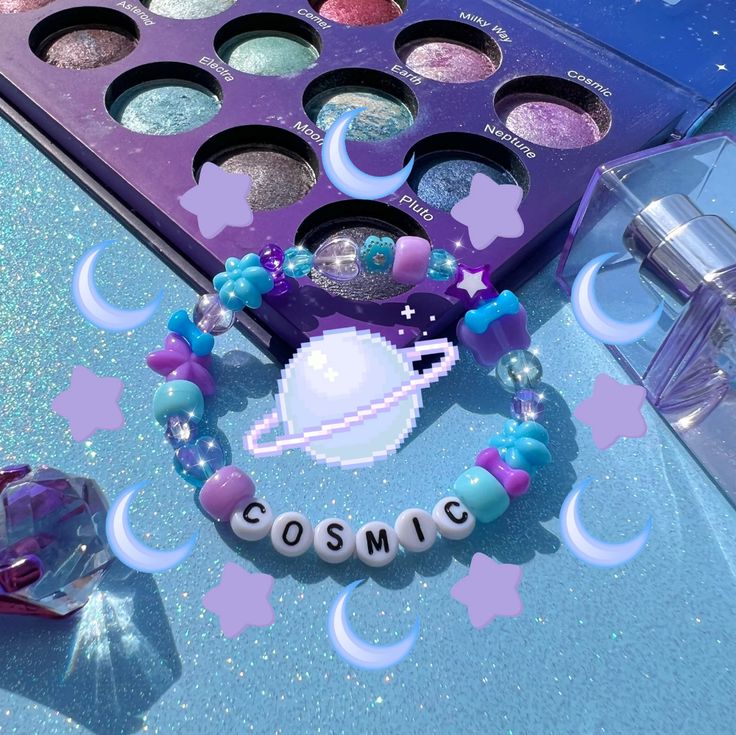 a close up of a box of cosmetics on a table with stars and moon decorations