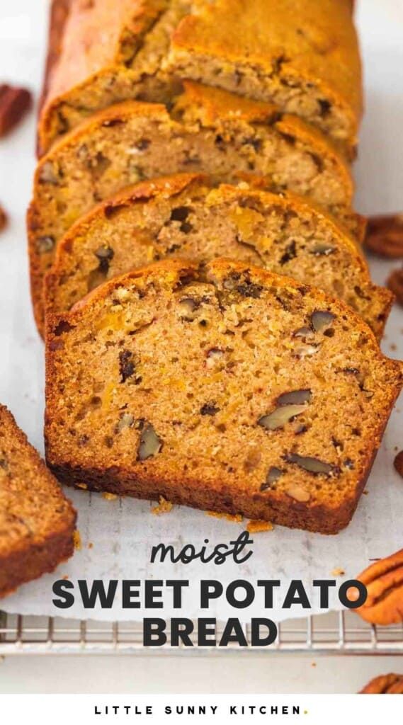 sliced loaf of sweet potato bread on a cooling rack with pecans in the background