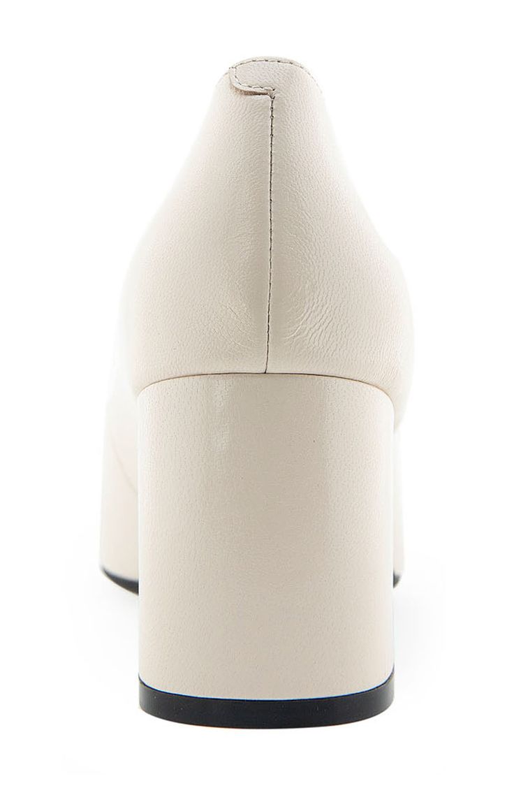 An almond toe defines this classic leather pump elevated by a half-moon block heel and a shock-absorbing sole. Leather upper/synthetic lining and sole Imported Cream Leather Block Heels With Padded Heel, Cream Leather Block Heels With Sculpted Heel, Cream Leather Heels With Platform, Cream Leather Platform Heels, Modern Cream Closed Toe Heels, Cream Court Shoes With Padded Heel And Medium Width, Cream Court Shoes With Sculpted Heel, Medium Width, Cream Platform Heels With Square Toe, Cream Square Toe Platform Heels