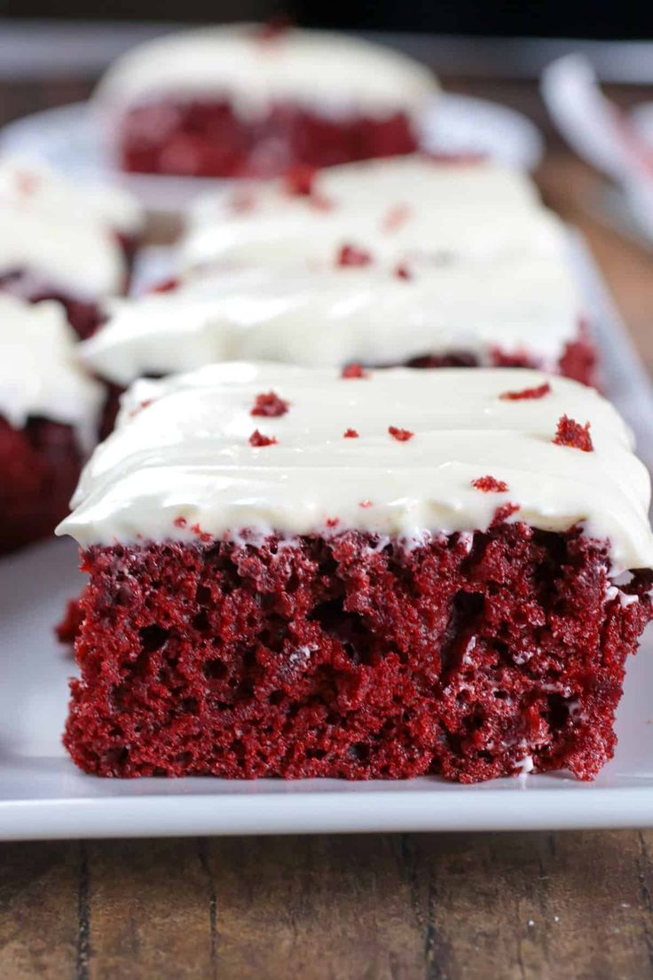 red velvet cake with white frosting on a plate