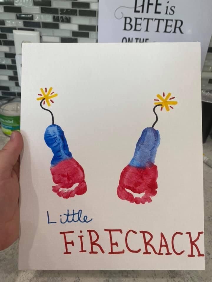 a hand holding up a card that says little firecracker