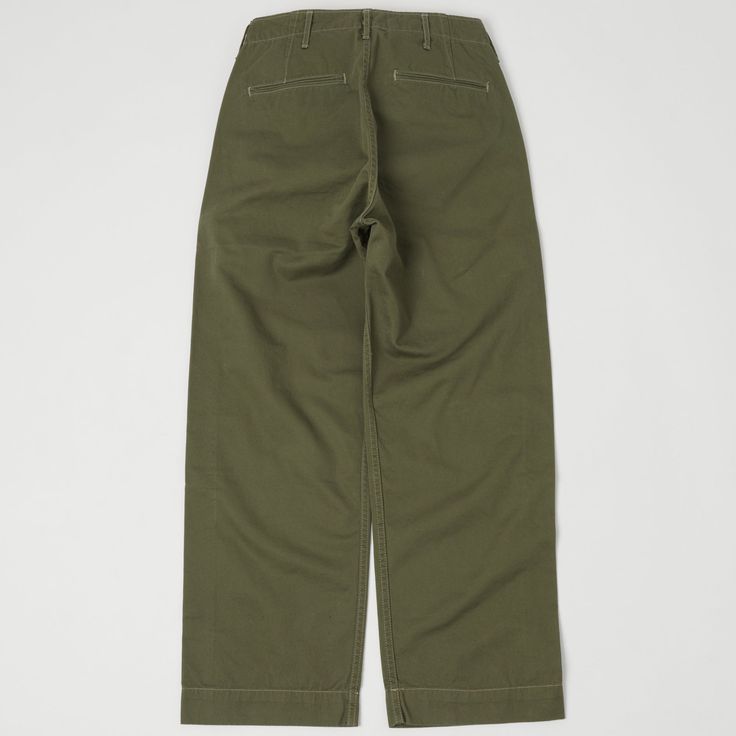 Inspired by the iconic M-41 chino worn by the U.S. Army during WWII, Full Count have released a trouser which really lives up to the brand’s reputation for authenticity and quality. The 1201 chino is a loose fitting trouser with a deep rise which allows for comfort and maximum breathability. Just like the 1941 version these chinos have a flat felled seam on both the inner and outer leg seams and slip watch pocket at the waistband. The 1201 from Full Count is a faithful reproduction of the M-41 w Green Full Length Chinos With Pockets, Casual Green Full-length Chinos, Army Surplus Store, Green Full-length Chinos With Pockets, Full-length Cotton Chinos With Hip Pockets, Full-length Cotton Chinos With Cargo Pockets, Flat Felled Seam, Army Surplus, Clothing Co