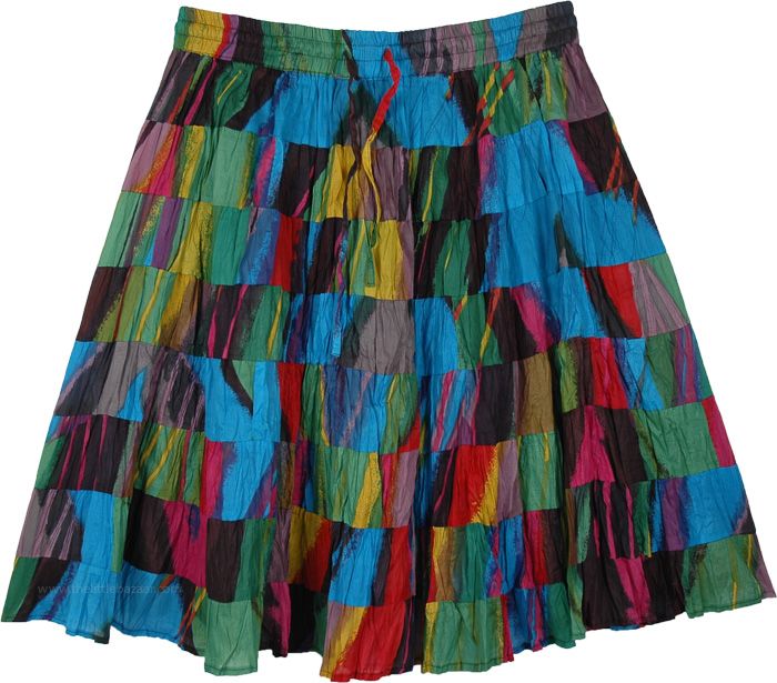 A lined short cotton skirt in blue and green print and made in 8 tiers of increasing circumference which gives it flare, volume and bounce. This skirt will be knee length or shorter or longer depending on how tall you are. It has an elastic waistband and drawstring and the skirt easily fits sizes small to large. Multicolor Cotton Knee-length Skirt, Multicolor Knee-length Cotton Skirt, Multicolor Cotton Mini Skirt With Lining, Multicolor Flared Cotton Mini Skirt, Multicolor Cotton Flared Mini Skirt, Multicolor Cotton Tiered Mini Skirt, Multicolor Tiered Cotton Mini Skirt, Multicolor Cotton Ruffled Skirt, Green Cotton Tiered Mini Skirt