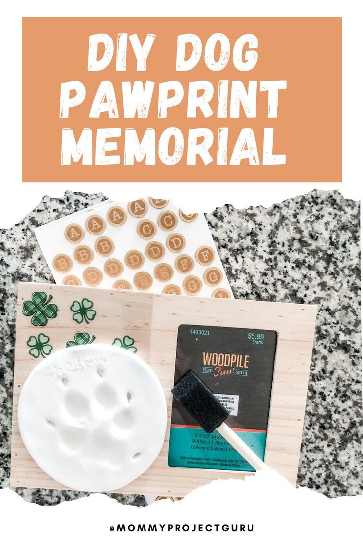 the diy dog pawprint memorial is on display in front of some other items