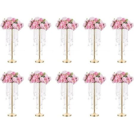 twelve pink flowers are arranged on gold poles