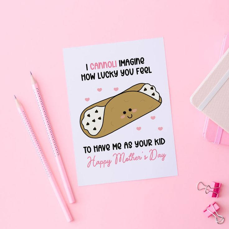 a mother's day card with a taco on it and two pencils next to it