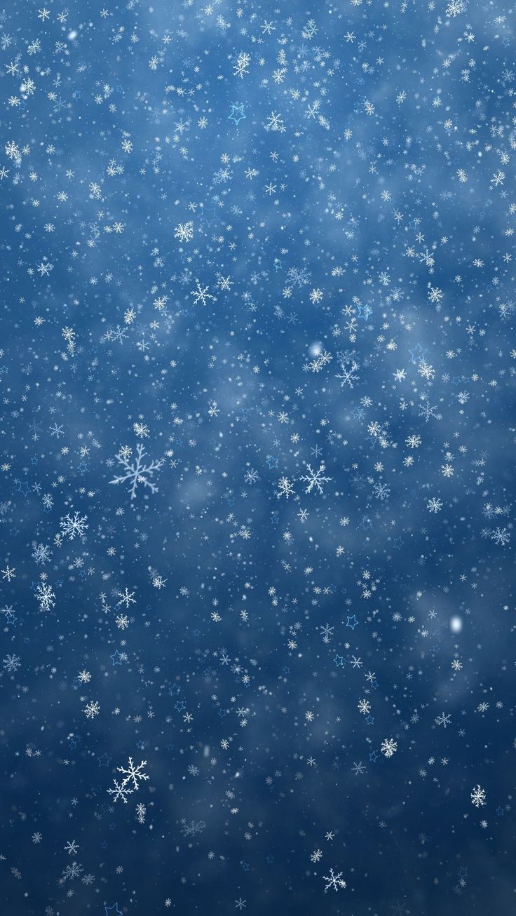 snow flakes are falling down on the blue background