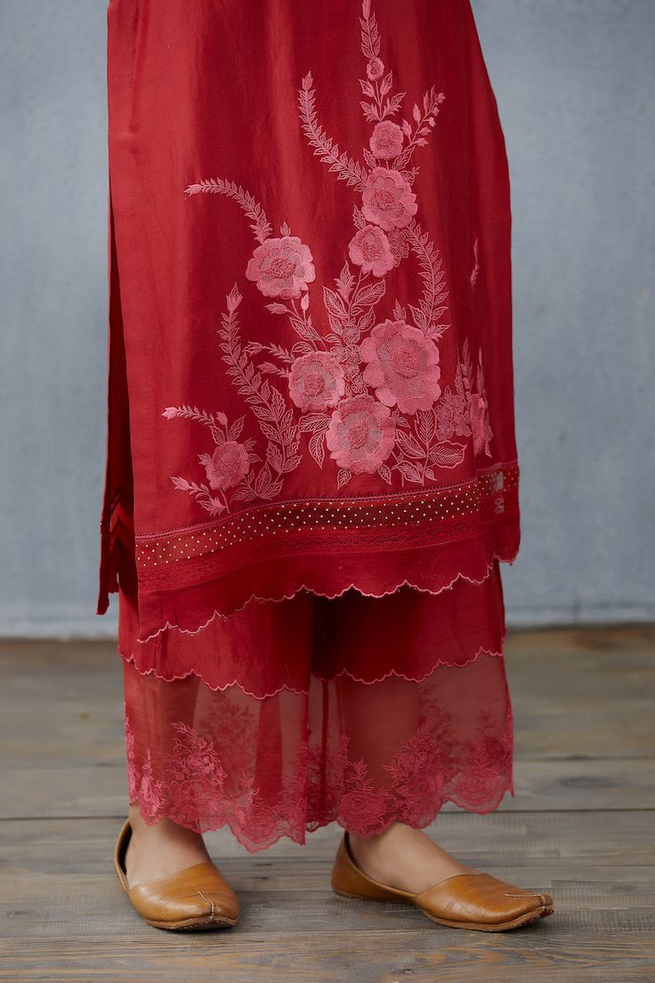 Editor's Note Featuring Crimson Kumudani Naavya Kurta Set Color: Crimson Fabric: Tulle & Silk Organza & Handwoven Chanderi Component: Kurta, dupatta and pant Care: Dry Clean Only About the Designer Torani by Karan Torani stands handcrafted luxury inspired by the myriad tales of Indian mythology. Torani is a potpourri of all things nostalgic that binds you with a memory long forgotten. The label works with and revives timeless Indian textiles and embroidery traditions. Latest Trouser Designs Pakistani, Trouser Designs Pakistani, Indian Mythology, Kurta Patterns, Simple Kurta Designs, Salwar Designs, Kurti Designs Latest, Trouser Design, Designer Kurtis