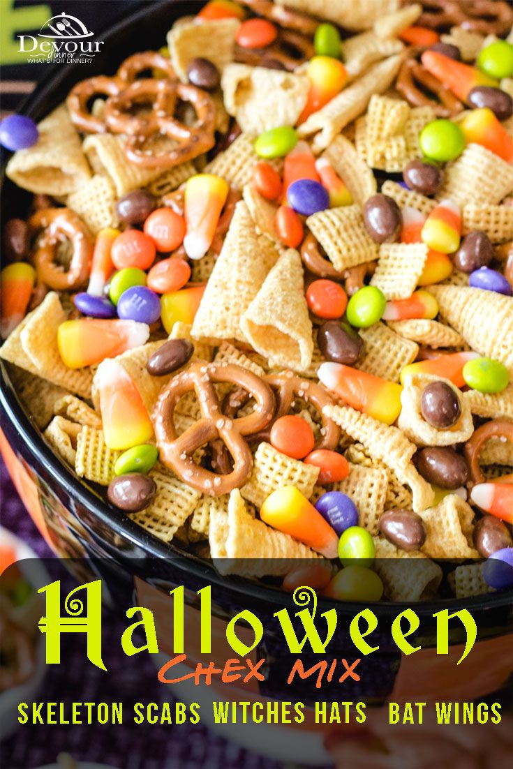 halloween chex mix in a bowl with candy and pretzels