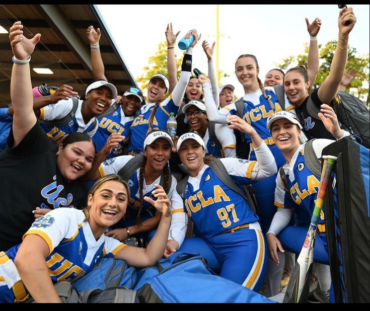 a group of women in blue and white uniforms posing for a photo