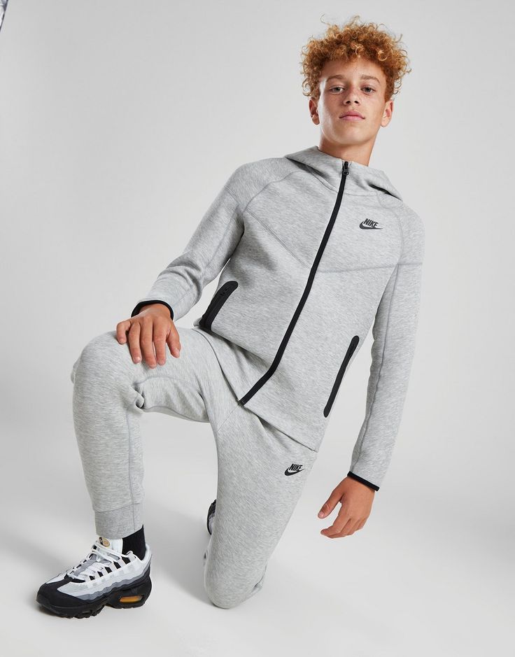 Cop a street essential with this juniors' Tech Fleece Full Zip Hoodie from Nike. Landing in a Grey colourway, this standard-fit hoodie is made with Nike's super-soft and warm Tech Fleece fabric for max' comfort. It features full zip fastening so you can switch up your style, stretchy ribbed trims to hold the shape, and zippered pockets for essential storage. Signed off with the Futura logo to the chest. Machine washable. Grey Nike Tech Fleece, Grey Nike Tech, Nike Uptempo, Nmd Adidas, Nike Tech Fleece Hoodie, Tech Fleece Hoodie, Plus Size Joggers, Nike Sweats, Nike Joggers