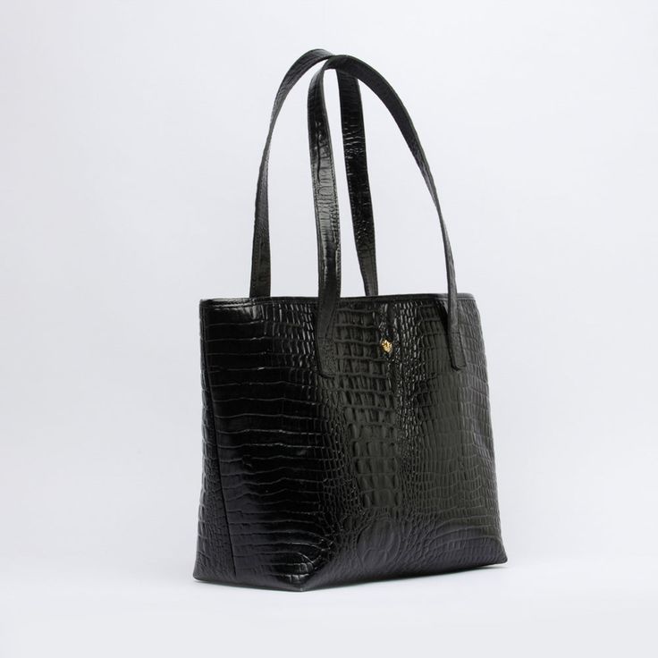 Material: Structured croc-embossed genuine cow leather. Interior: Lined with canvas Color: Black Height: 29 cm 11.4 inch Length: 35 cm 13.8 inch Depth: 18 cm 7.1 inch Weight: 0.74 Kg 1.63 Lb. Classic Leather Shoulder Bag With Crocodile Pattern, Leather Shoulder Bag With Crocodile Pattern For Business, Business Leather Shoulder Bag With Crocodile Pattern, Modern Black Shoulder Bag With Crocodile Pattern, Modern Black Crocodile Pattern Shoulder Bag, Classic Crocodile Pattern Shoulder Bag For Work, Black Crocodile Pattern Shoulder Bag For Work, Black Crocodile Pattern Bag For Work, Black Leather Bag With Crocodile Pattern