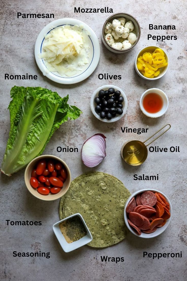 the ingredients for an italian salad laid out in bowls