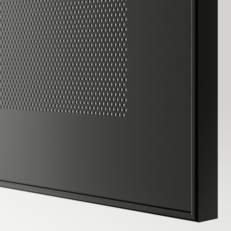 the back side of a black cabinet with white dots on it's front and sides