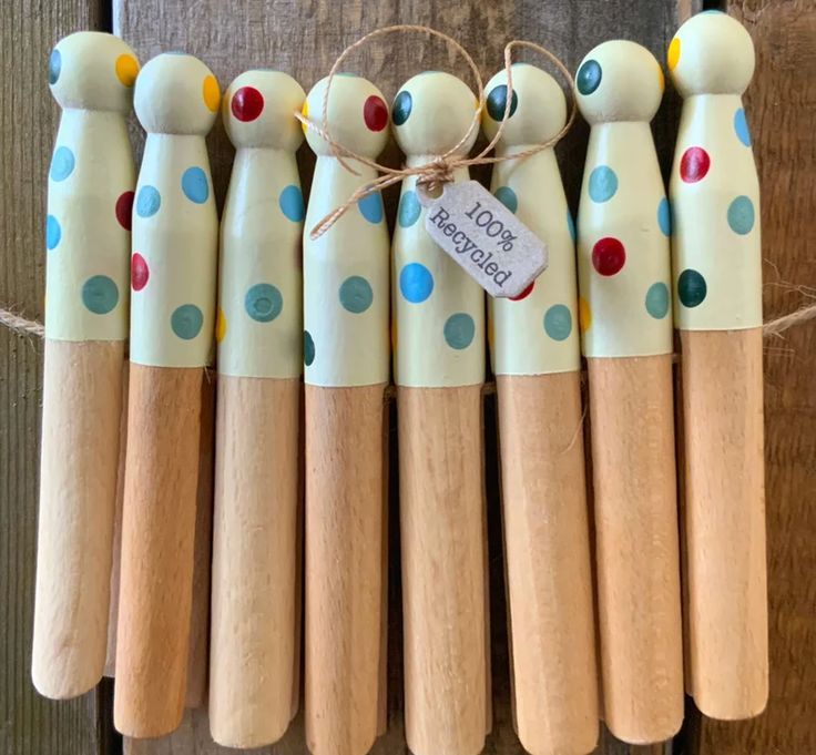 six wooden pegs with polka dot designs on them