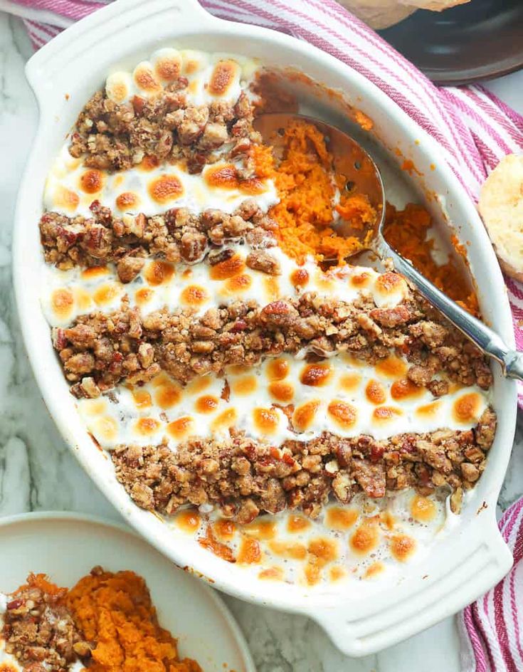 sweet potato casserole with marshmallows in a white dish