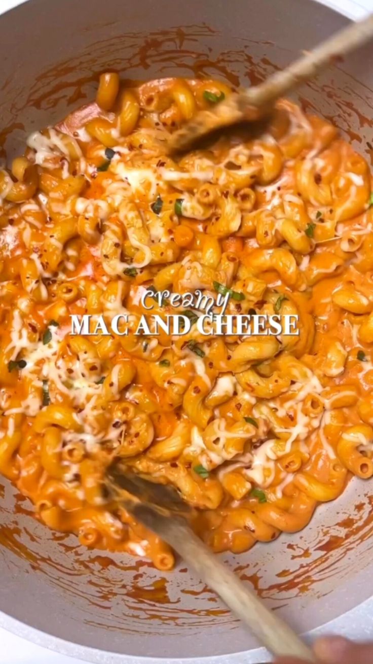 macaroni and cheese being cooked in a pan