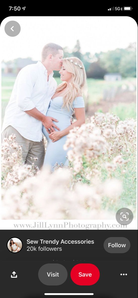 a couple kissing in the middle of a field