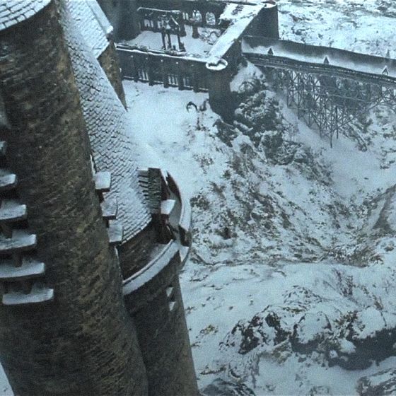 an aerial view of a castle in the snow