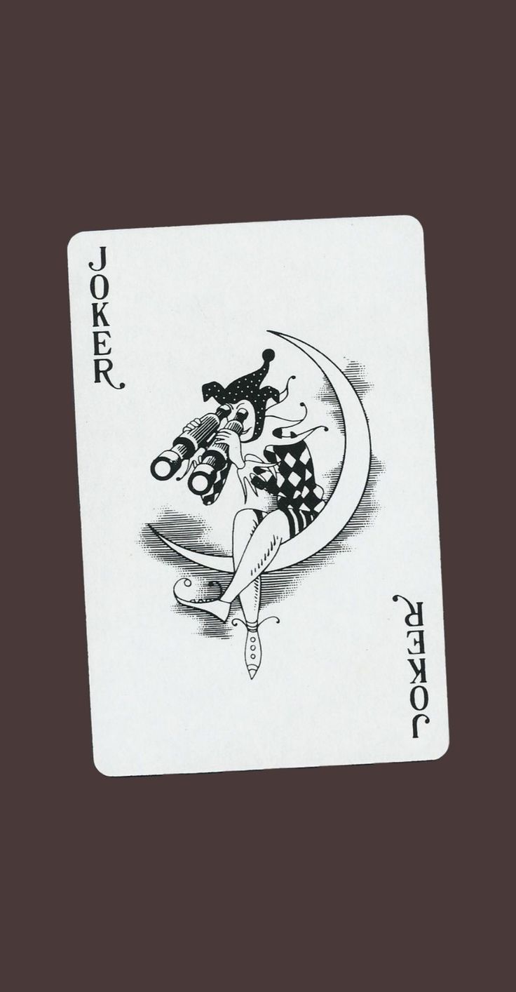 a black and white playing card with an image of a woman sitting on the moon