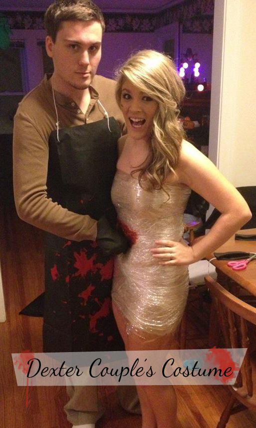 a man and woman standing next to each other in front of a table with food on it